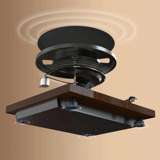 Manual belt drive turntable with wood finish and vibration isolation feet on tan background