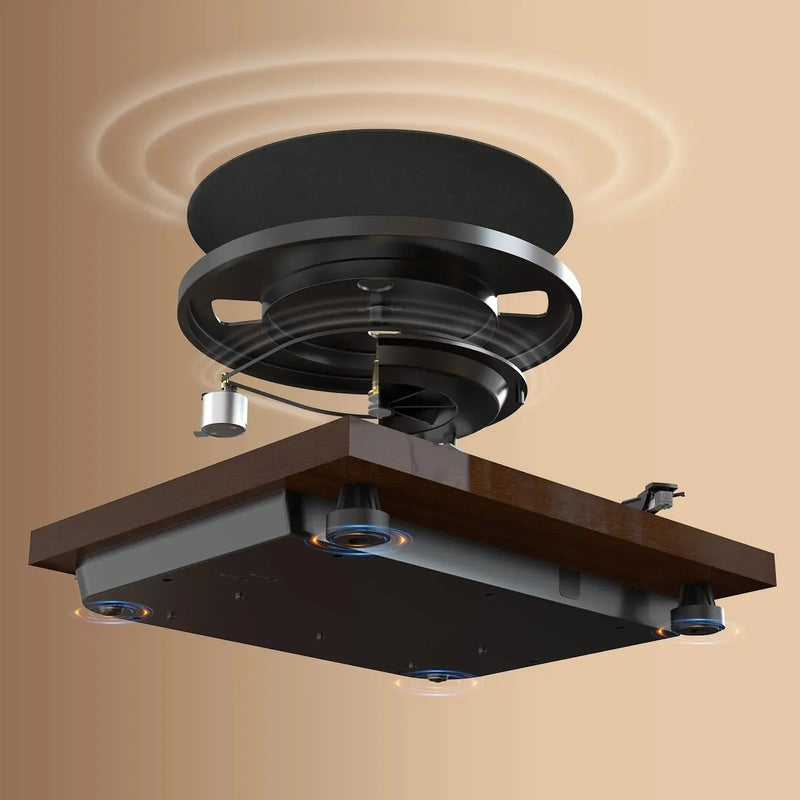 Manual belt drive turntable with wood finish and vibration isolation feet on tan background
