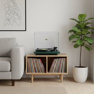 Bluetooth turntable on wooden stand with vinyl records in modern living room