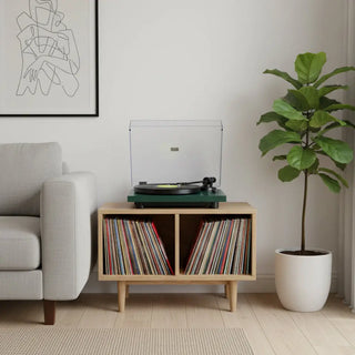 Bluetooth turntable on wooden stand with vinyl records in modern living room