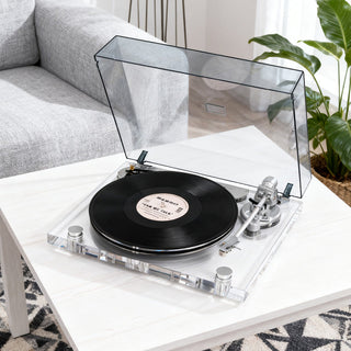 Transparent Retrolife ICE1 vinyl record player on white table in modern living room